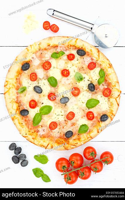 Pizza margarita margherita from above baking ingredients on wooden board portrait format wood