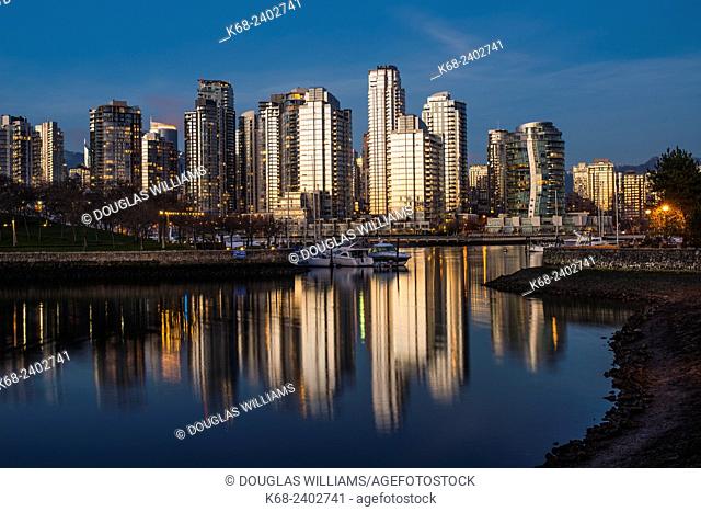 Alder Bay at sunset, with reflections of downtown buildings, Vancouver, BC, Canada
