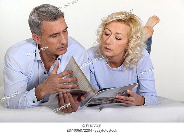 Couple looking at a catalogue