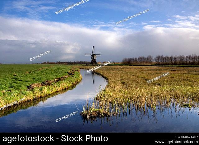 Dutch polder landscape with a windmill in the region Alblasserwaard