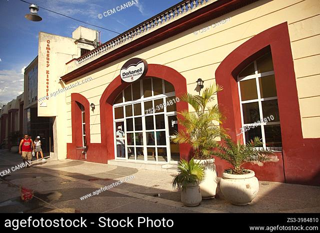 People in front of the shops at the historic center, Camagüey, Cuba, West Indies, Central America