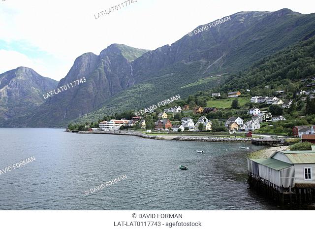Flam is a village at the inner end of the Aurlandsfjord inlet, an arm of the Sognefjord. The village has a mountain railway through mountain scenery