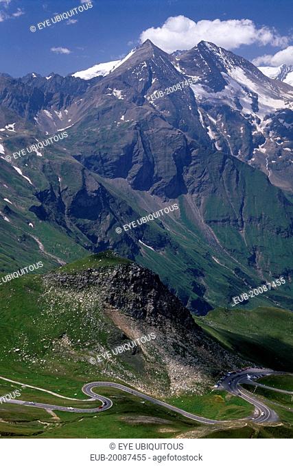 View towards Glockner Group and the Grossglockner Road from Edelweisse-spitze view point. Jagged points with snow lying in crevices of peaks