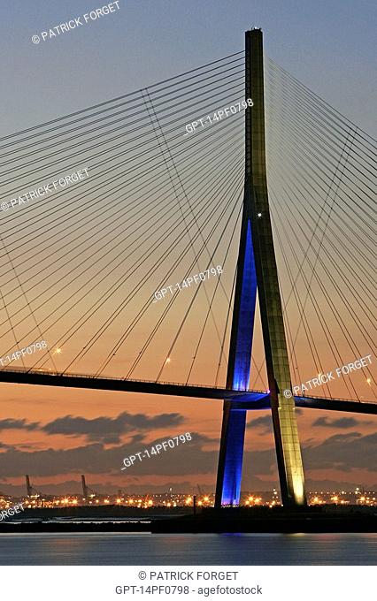 A VIEW AT NIGHT OF THE NORMANDY BRIDGE WHICH SPANS THE SEINE BETWEEN HONFLEUR AND LE HAVRE, A 2143 METER CABLE-STAYED BRIDGE WITH 856 METERS BETWEEN THE TOWERS