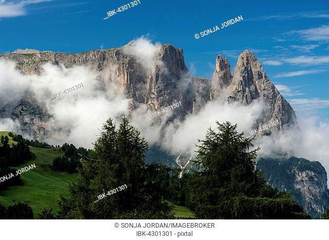 Schlern or Sciliar, Euringerspitze and Santnerspitze, clouds, Seiser Alm, Schlern-Rosengarten Nature Park, Dolomites, South Tyrol, Italy