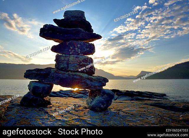 Rock inukshuk in front of Salt Spring Island, Russell Island, British Columbia, Canada