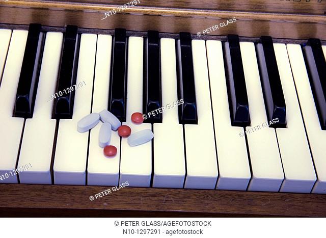 Pills on a piano keyboard