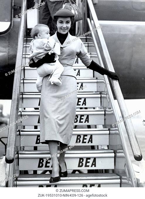 Oct. 10, 1953 - London, England, U.K. - Ttwo-time Academy Award-winning British-American actress ELIZABETH 'LIZ' TAYLOR leaving an aircraft holding her son...