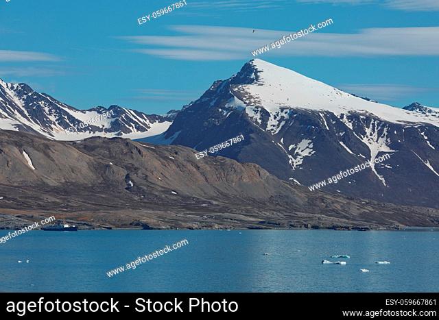 Mountains, glaciers and coastline landscape close to a village called
