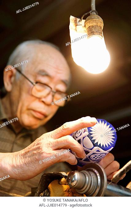 Edo Kiriko traditional Japanese glassware artisan working in the studio