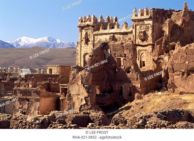 Ruins of Glaoui kasbah at Telouet, with the High Atlas mountains in the distance, Telouet, near Ouarzazate, Morocco, North Africa, Africa