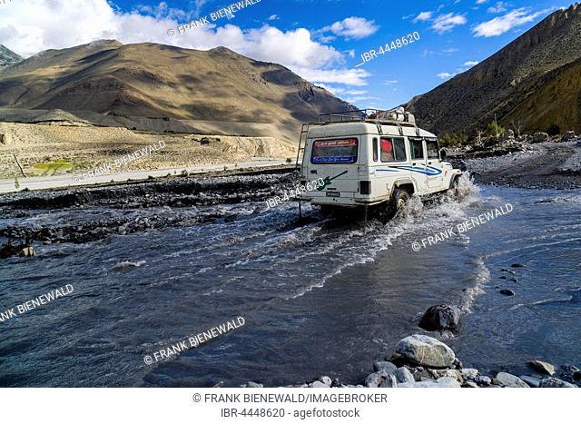 Jeep taxi is crossing a river, Josom, Kali Gandaki valley, Mustang District, Nepal