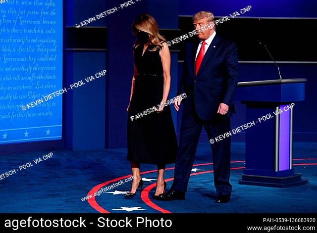 Republican presidential candidate President Donald Trump and first lady Melania Trump leave the stage after the final presidential debate with Democratic...