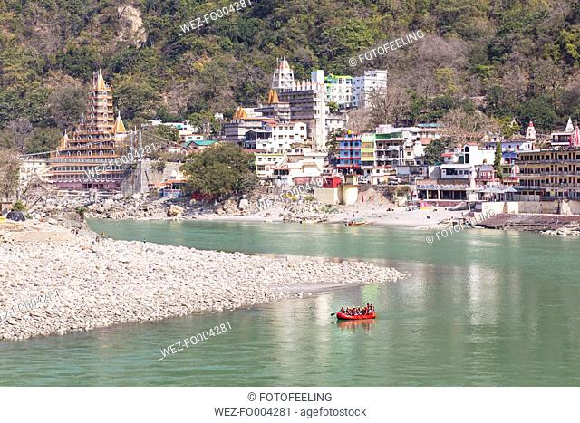 India, Uttarakhand, Rishikesh, View of Swarg Niwas Temple at River Ganges
