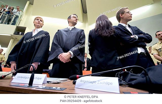Accused Beate Zschaepe (2-R), 38, talks to her lawyers Wolfgang Stahl (2-L), Wolfgang Heer (R) and Anja Sturm at the Higher Regional Court in Munich, Germany