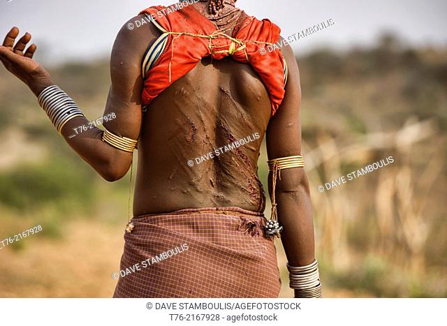 Hamer woman's back after being whipped at a bull jumping ceremony near Turmi in the Omo Valley, Ethiopia. The young women taunt the men into hitting them harder