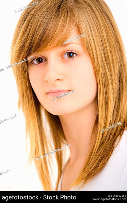 Closeup portrait of pretty teenage girl with long blond hair and big brown eyes, smiling. Isolated on white background