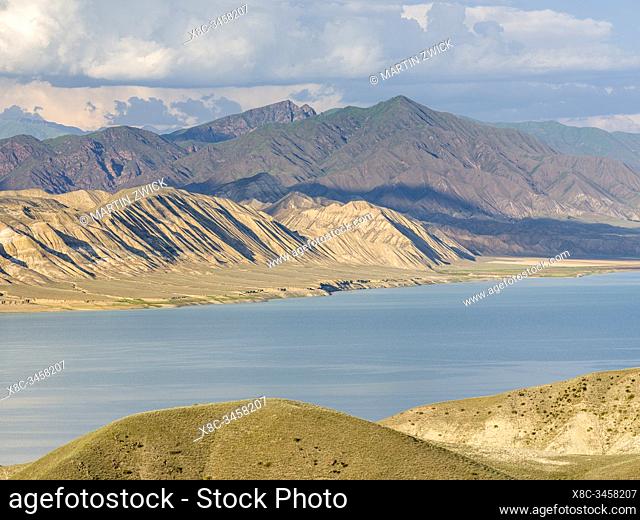 Landscape at Toktogul Reservoir and river Naryn in the Tien Shan or heavenly mountains. Energy is one of the most important export commodities
