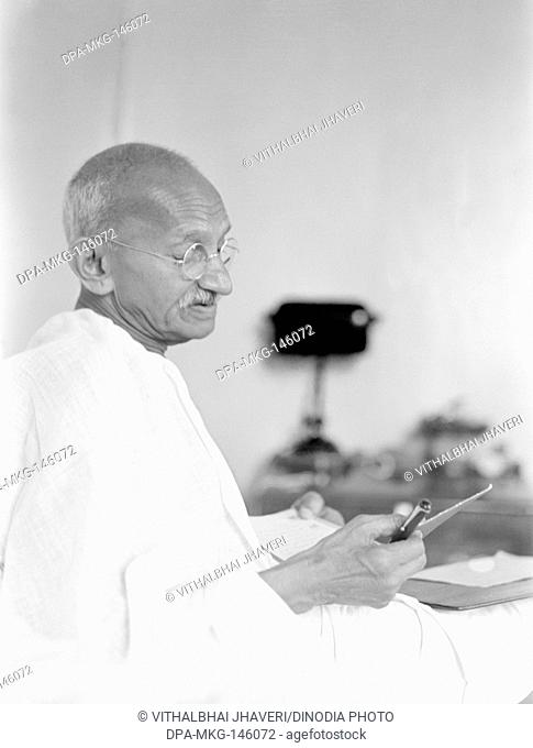 Mahatma Gandhi writing at Birla House ; Mumbai ; August 1942 ; India NO MR