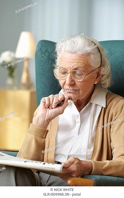Senior woman doing crossword