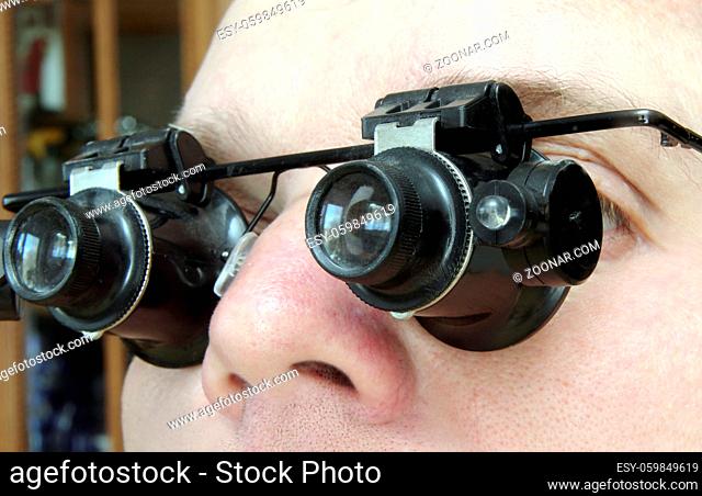 special glasses Microscopes on a man#39;s face