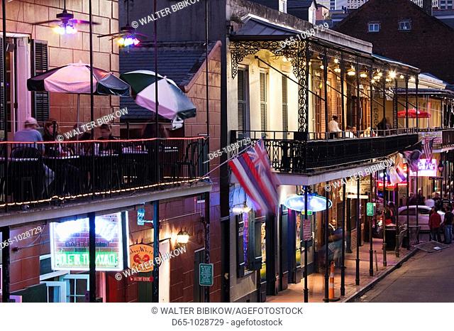 USA, Louisiana, New Orleans, French Quarter, Bourbon Street and city skyline, elevated view, dusk