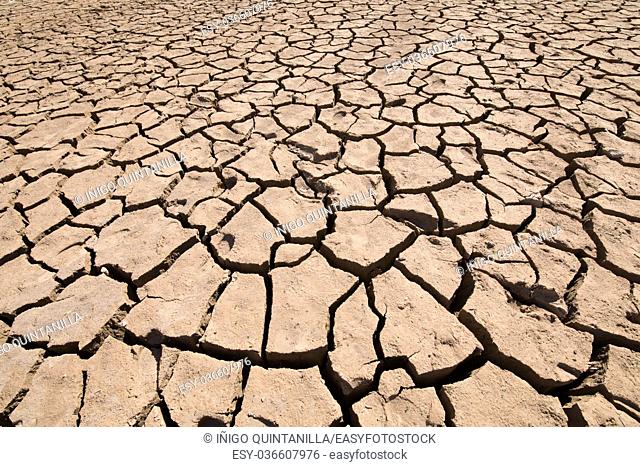 background detail of dry earth ground, drought in Entrepenas reservoir, in Guadalajara, Castilla, Spain Europe
