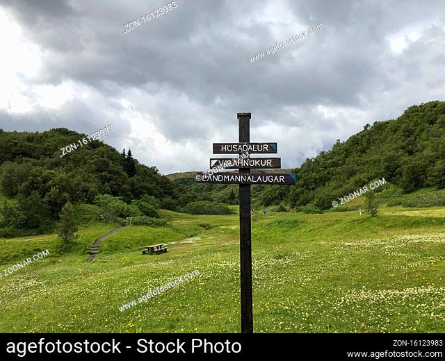 Thorsmork, Iceland, July 2019: Directional sign pole on Laugavegur hiking trail, pointing to husadalur, landmannalaugar, valahnukur