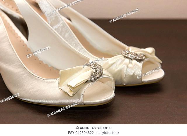 closeup of bridal shoes on a table