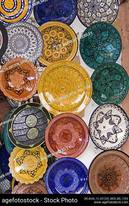 Colourful glazed terracotta plate display Marrakech Morocco