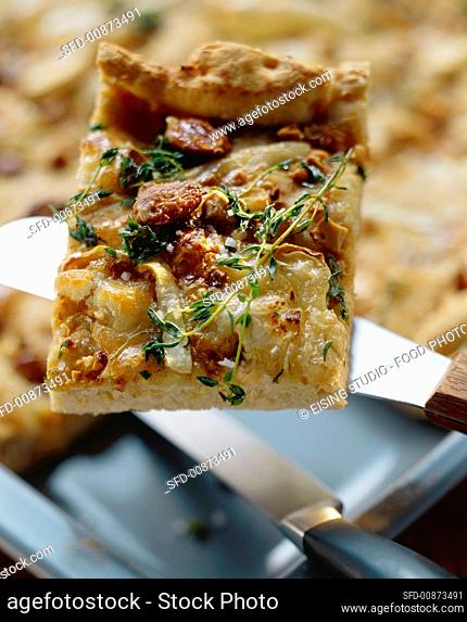Focaccia-style tray bake topped with goat's cheese & almonds