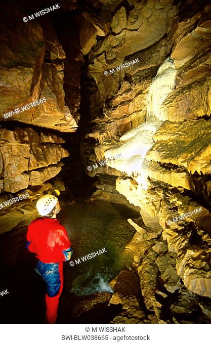 Falkenstein Cave, caver following underground river, Germany, Grabenstetten