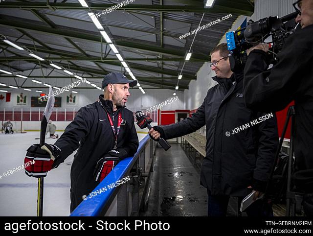 Alan Letang, the national team captain, is interviewed by Mark Masters, a reporter at TSN, when Canada's team trains in Limhamns Ice Hall in Malmö, Sweden