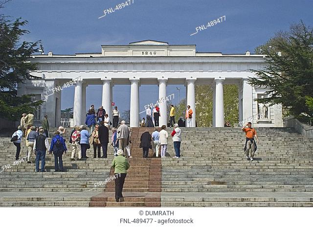 Tourists on staircase in front of colonnade, Crimea, Ukraine