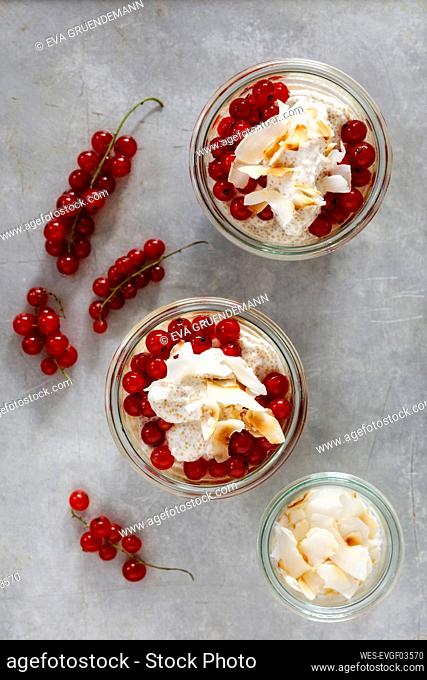 Jars of gluten free amaranth mousse with red currant berries