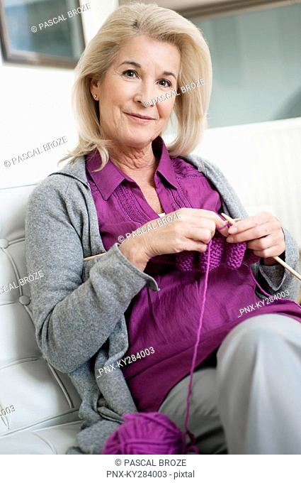 Portrait of a woman knitting