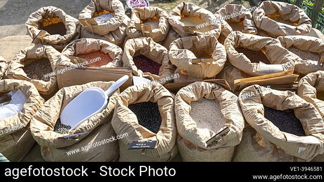 lined sacks full of legumes and seeds, ecological market of San Jeronimo, Seville, Andalucia, Spain
