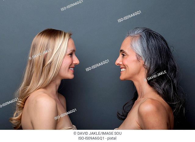 Young woman and mature woman face to face