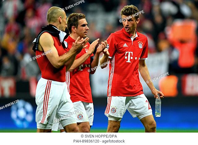 Munich's Arjen Robben (l-r), Philipp Lahm and Thomas Mueller react after the first leg of the Champions League quarter final match between Bayern Munich and...