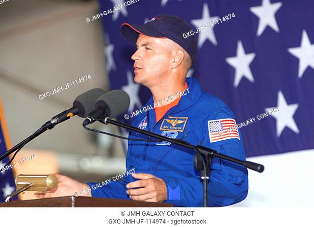 Frederick W. Sturckow, STS-105 pilot, speaks from the podium in Hangar 990 at Ellington Field during the STS-105 and Expedition Two crew return ceremonies