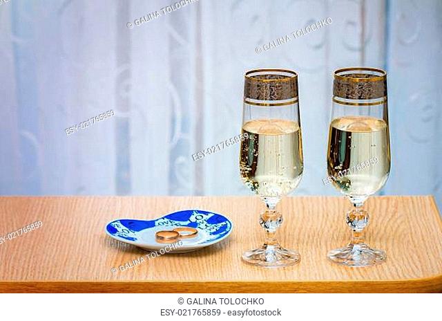 Two champagne flute filled with champagne