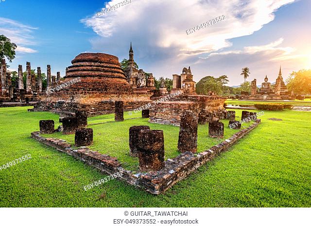 Buddha statue and Wat Mahathat Temple in the precinct of Sukhothai Historical Park, Wat Mahathat Temple is UNESCO World Heritage Site, Thailand