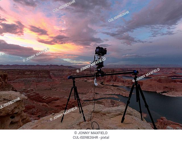 Camera on tripods photographing view of Lake Powell and canyons, Alstrom Point, Utah, USA