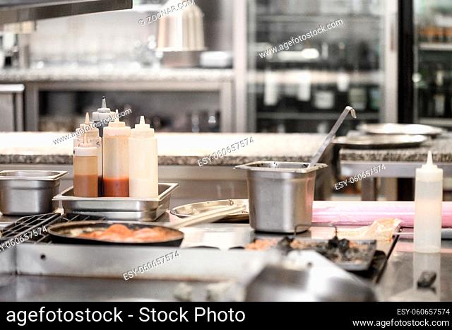 Food being cooked in commercial stainless steel kitchen in restaurant. High quality photo