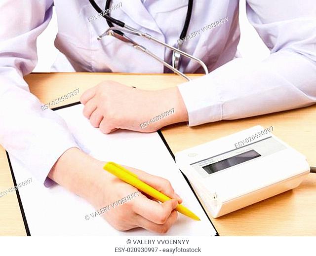 doctor measures blood pressure during appointment