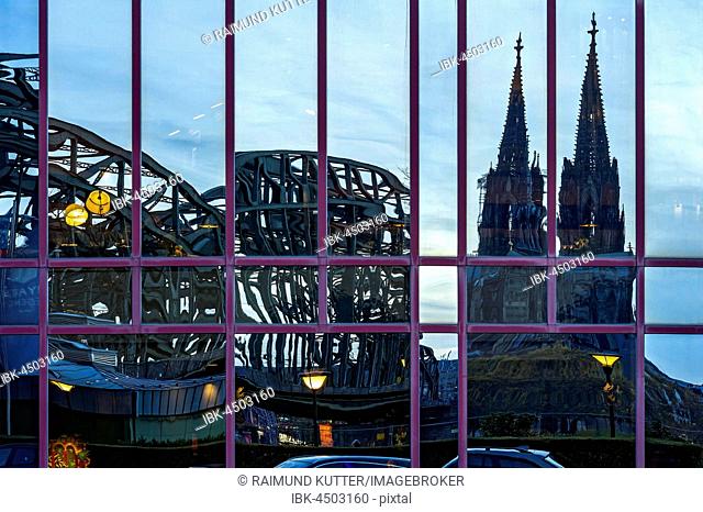 Reflection in glass facade of the Hyatt Regency Hotel, Hohenzollern Bridge, Cologne Cathedral, Cologne, North Rhine-Westphalia, Germany