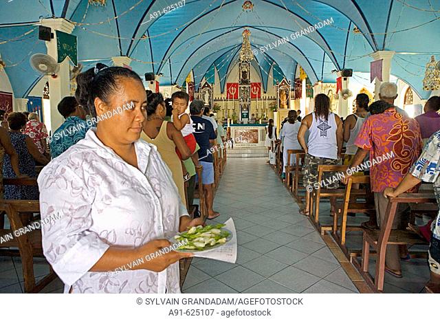 Sunday mass. Stopover in Fakarava atoll. Cruise on Aranui III, cargo and passenger vessel, delivering goods to Marquesas and Tuamotus islands from Tahiti and...