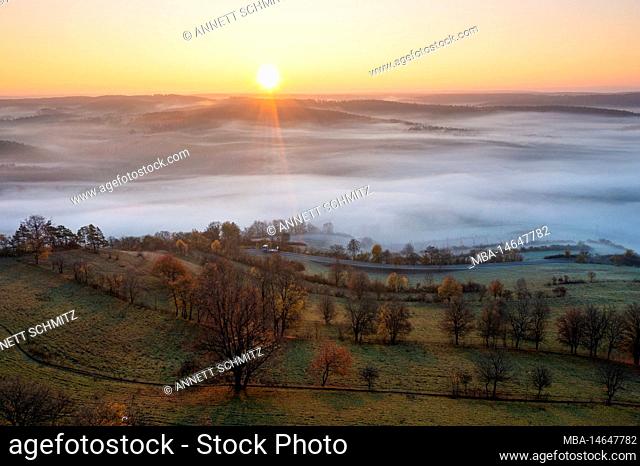Sunrise with ground fog in Thuringia near the Leuchtenburg