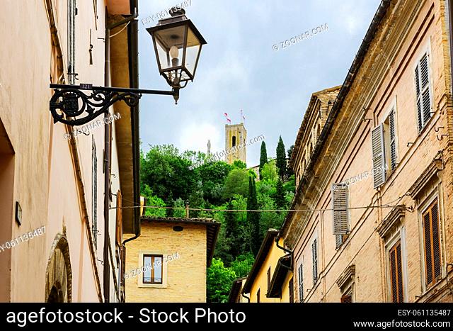 Narrow street with view to castle in San Severino Marche Italy