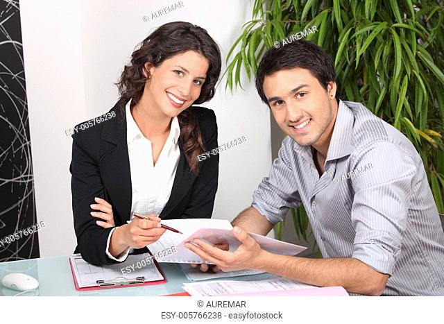 Businesswoman discussing a contract with her client